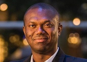 A photo of Azubuike (Zuby) Onwuta smiling at the camera.