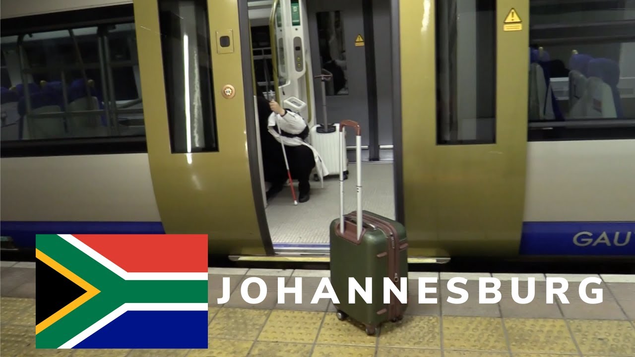 A thumbnail for The Power of Determination: Do I make it? Johannesburg Episode 1 Part 1. An image of Mona boarding a metro train in Johannesburg. Superimposed on the image is the South African Flag.